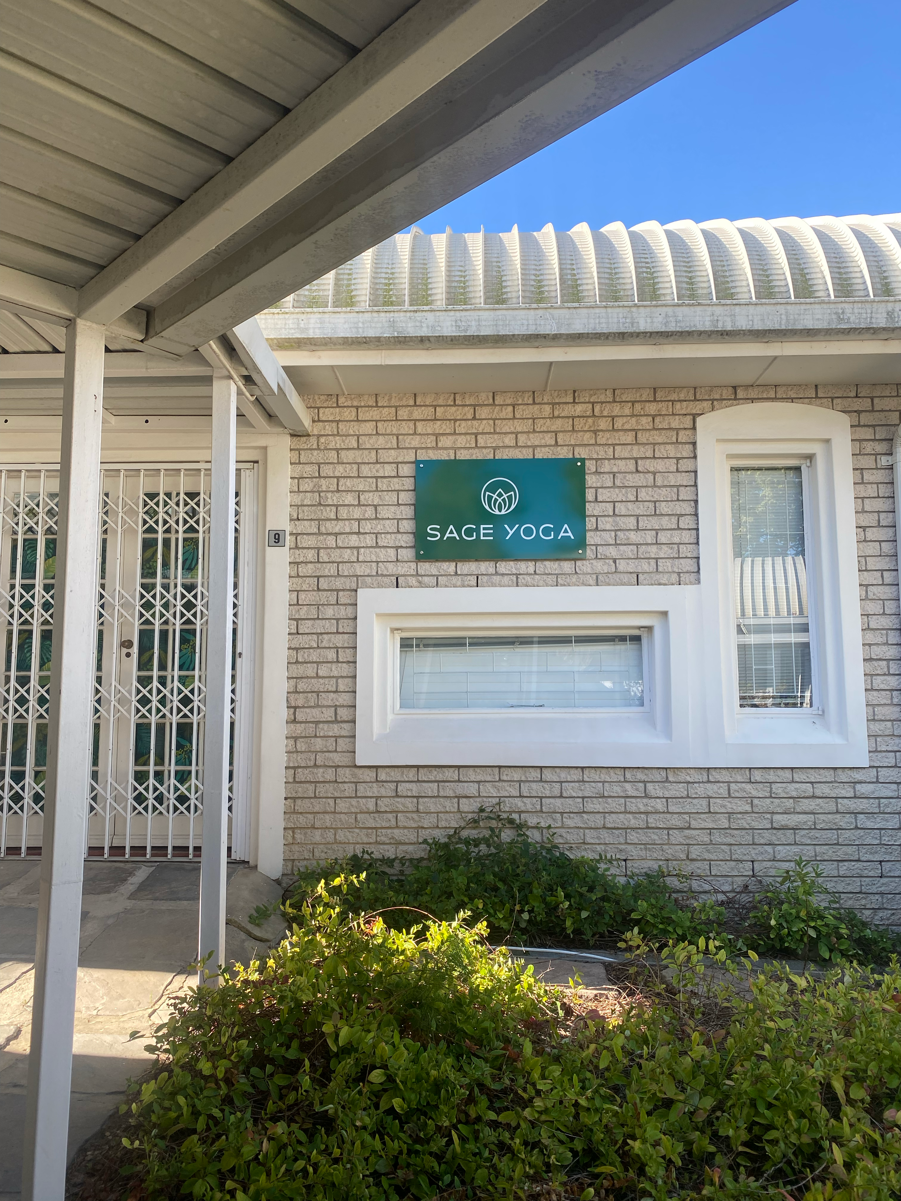 Sage Yoga studio signage